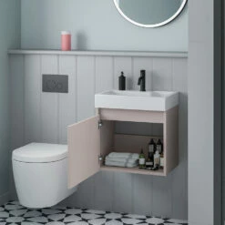 Minnie 500mm Wall Mounted 1 Door Vanity Unit & Polymarble Basin - Blush Pink -TAP WAREHOUSE Shop drench minnie blush pink 500mm wall hung unit internal lifestyle