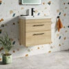 Emily 500mm Natural Oak Wall Mounted 2 Drawer Vanity Unit, Thin-Edged Basin, Matt Black Handles & Overflow 1 Emily 500mm Natural Oak Wall Mounted 2 Drawer Vanity Unit, Thin-Edged Basin, Matt Black Handles & Overflow -TAP WAREHOUSE Shop emily oak 2draw 600 wall black handles lifestyle