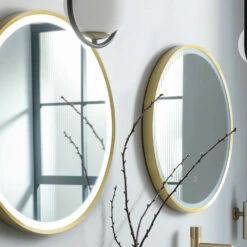 VOS LED Illuminated Round Brushed Brass Framed Mirror With Demister Pad & Colour Change Lights - 600mm 18 VOS LED Illuminated Round Brushed Brass Framed Mirror With Demister Pad & Colour Change Lights - 600mm -TAP WAREHOUSE Shop just taps vos brushed brass 600mm mirror light demister lifestyle 2