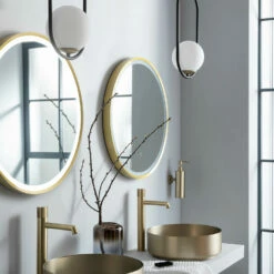 VOS LED Illuminated Round Brushed Brass Framed Mirror With Demister Pad & Colour Change Lights - 600mm 17 VOS LED Illuminated Round Brushed Brass Framed Mirror With Demister Pad & Colour Change Lights - 600mm -TAP WAREHOUSE Shop just taps vos brushed brass 600mm mirror light demister lifestyle