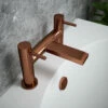 The Tap Factory Vibrance Polished Copper Deck Mounted Bath Filler With Vanto Black Handles -TAP WAREHOUSE Shop tap factory brushed copper bath filler lifestyle