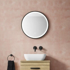 VOS LED Illuminated Round Brushed Brass Framed Mirror With Demister Pad & Colour Change Lights - 600mm 16 VOS LED Illuminated Round Brushed Brass Framed Mirror With Demister Pad & Colour Change Lights - 600mm -TAP WAREHOUSE Shop vos 600mm round mirror led illuminated matt black lifestyle
